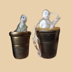 Pair of Frozen Charlotte Thread Waxers with Thimbles